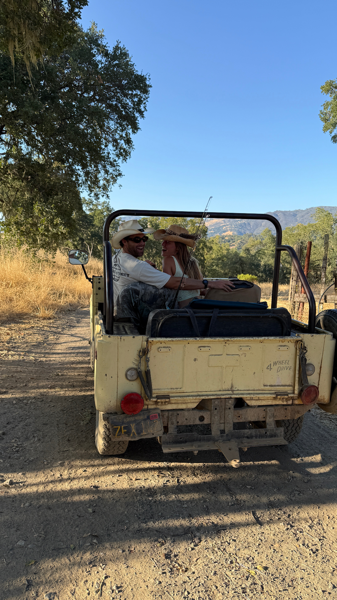 Claire and Willy in a vintage Jeep on the family ranch